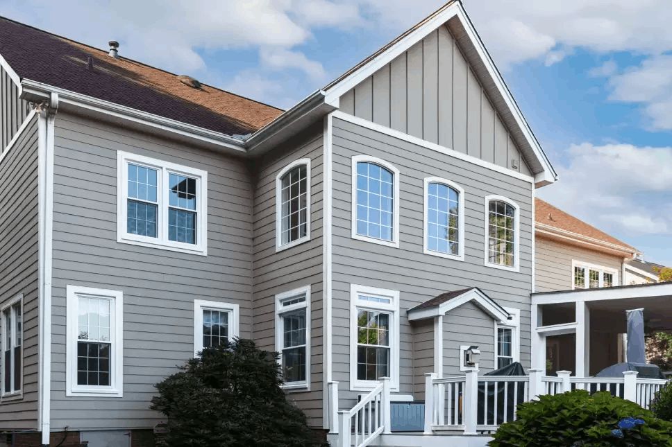 Exterior view of house with both horizontal and vertical siding.
