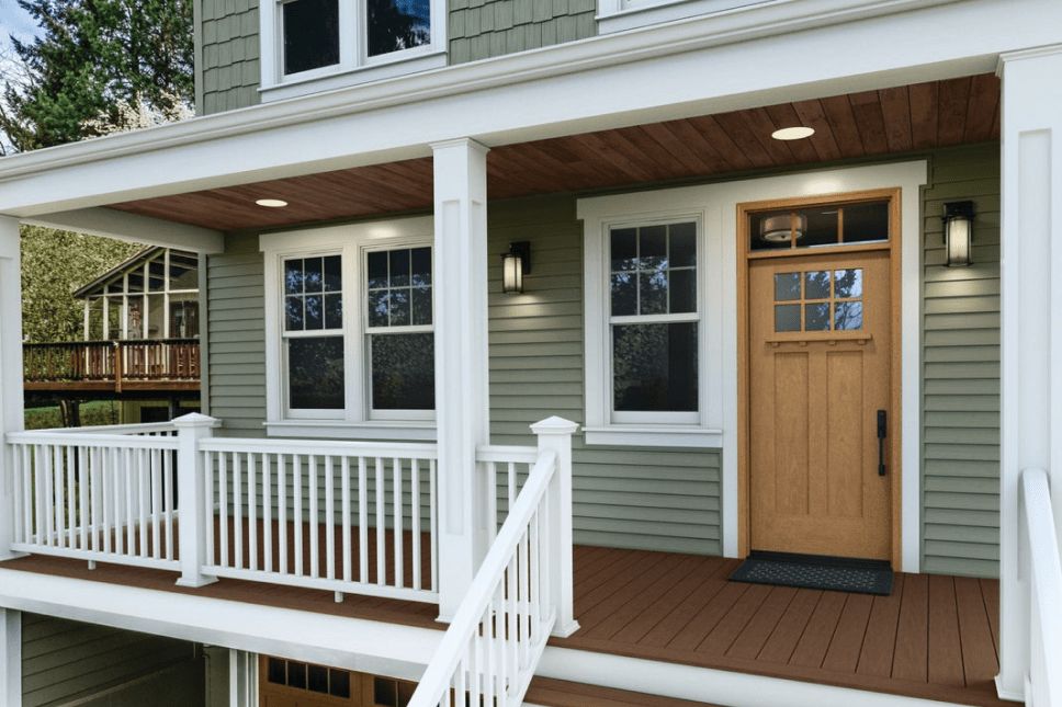 Woodgrain exterior door on a home with a raised porch.