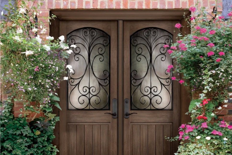 Woodgrain double entry doors with Camelia decorative glass.