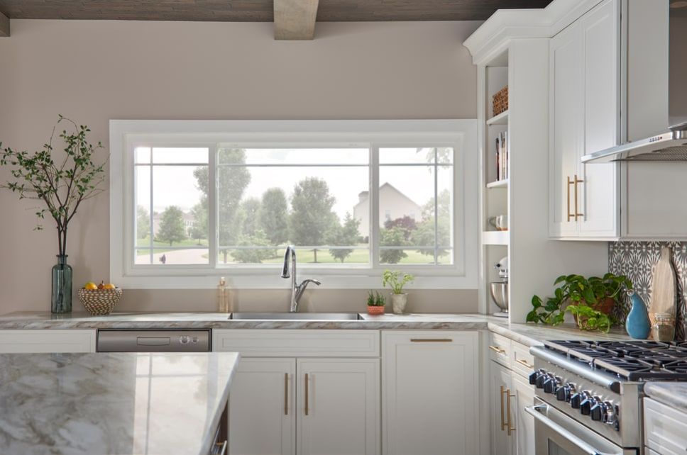 Sliding window behind a kitchen sink.